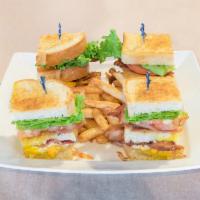 Club Sandwich · Ham, turkey, bacon, cheddar cheese, tomatoes, lettuce and mayo. Served on 3 pieces of wheat....