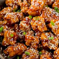 Sesame Chicken · Chunks of chicken with chef's special sauce with sesame seeds of top.