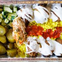 Falafel over Rice · Mixed vegetables and special spices combined to create delicious deep-fried veggie balls ove...
