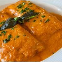 Cannelloni · Homemade pasta wrapped tubes filled with ricotta and baby spinach, baked with tomato sauce w...