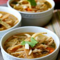 Large Chicken Tortilla Soup · Our famous tortilla soup finished with avocado, cabbage, rice, cotija, tortilla strips and c...
