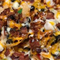 Loaded Nachos · Nachos piled high with chili, jalapenos, cheese, onions, tomatoes. Olives topped with guacam...