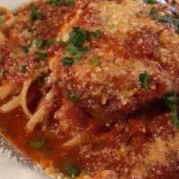 Chicken Parmesan · Breaded chicken cutlet sauteed and fnished in our homemade marinara sauce then baked with ou...