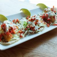 Baja Fish Tacos · 3 pieces. Crispy fried fish filet, pico de gallo, shredded cabbage, avocado cream sauce, and...