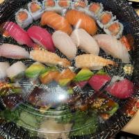 Sushi Deluxe · 10 pieces sushi, 8 pieces rainbow, 6 pieces spicy tuna and 8 pieces dragon roll.