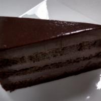 Chocolate Fondant Cake · Chocolate layer cake filled with a rich chocolate cream covered with chocolate ganache and r...
