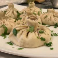 4 Pieces Khinkali · Traditional Georgian boiled dumplings filled with beef meat, greens and spices 