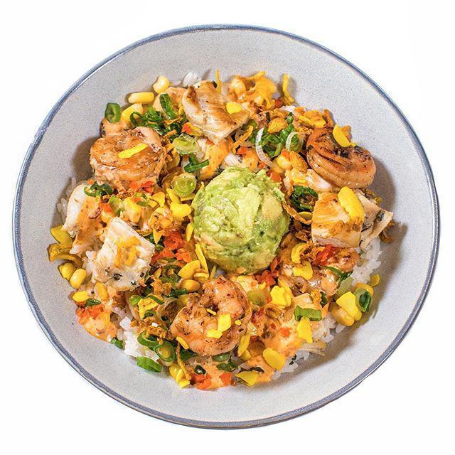 Gangnam Bowl · Grilled Shrimp and Chicken, corn, spicy kimchi aioli, avocado, scallion, pickled radishes and ginger, golden crispy shallots, turmeric roasted almond. (Mild Spicy)