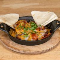 Chorizo Mexicano · Spicy sausage topped with melted cheese with side of flour tortilla. Spicy.