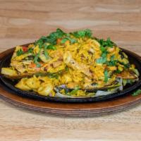 Mexican Seafood Paella · Paella with grilled chicken, clams, shrimp, scallops, calamari and jalapeño. Cilantro garnis...