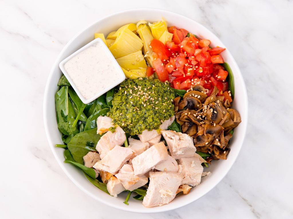 Gluten-Free Pesto Cowboy Salad · Spinach, artichokes, tomatoes, sauteed mushrooms, pesto, sesame seeds, vegan ranch dressing. Served with your choice of roasted antibiotic-free chicken or roasted sesame tofu.
