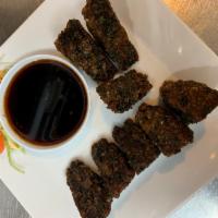 9. Chive Pancake · Fried chive patties served with sweet soy dipping sauce.