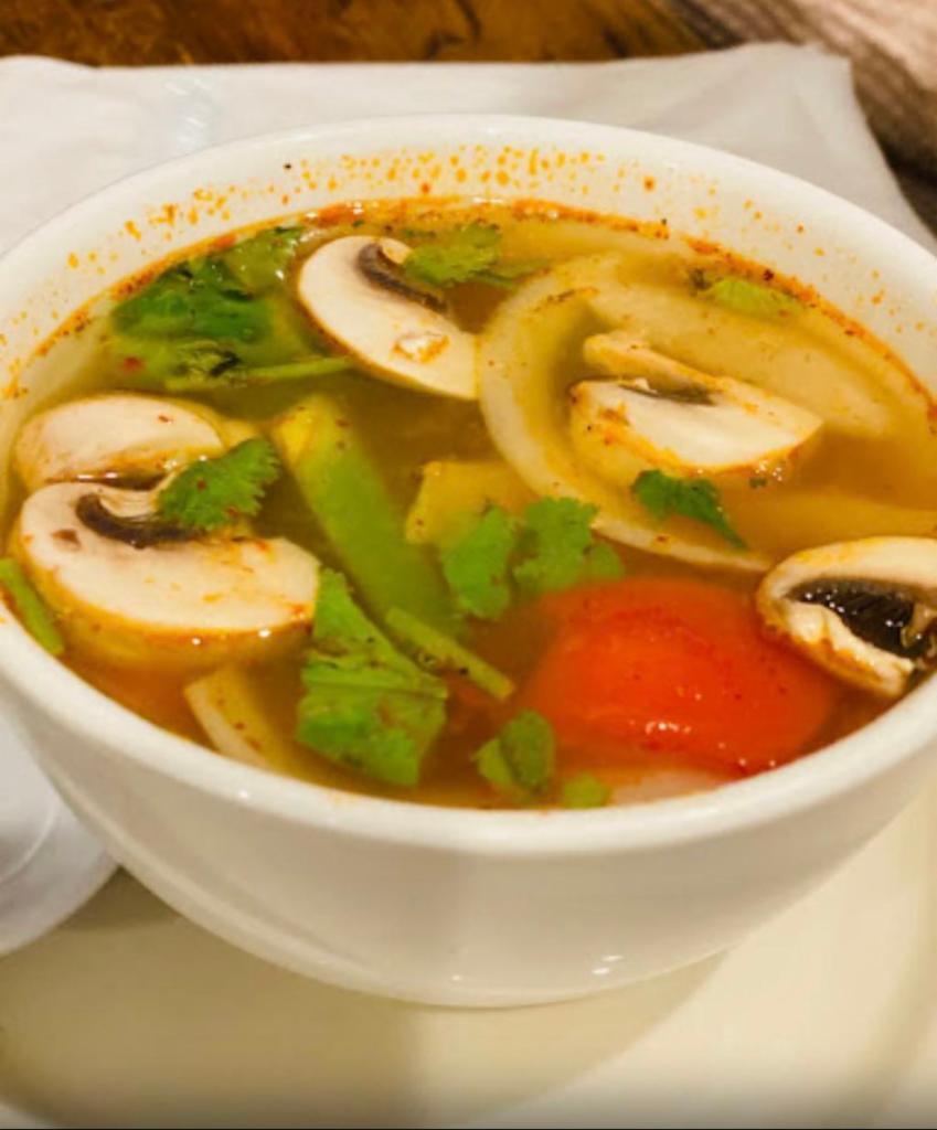 15. Tom Yum Soup · Spicy sour lemongrass soup with lime leaves, galangal, mushrooms, onions, bell peppers and cilantro. Spicy.