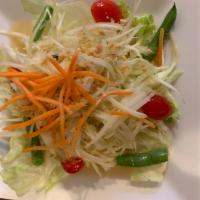 19. Papaya Salad · Shredded green papaya with tomatoes, string beans, ground peanuts in a spicy chili-lime vina...