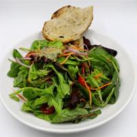 House Salad · Spring mix, carrots, onions, tomatoes, mint and honey pomegranate vinaigrette.