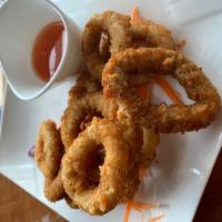 Crispy Calamari Rings · Calamari deep fried golden brown and served with our homemade plum sauce and ground peanuts.