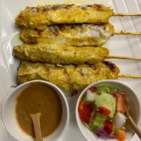 4 Chicken Satay Skewers · Skewered chicken marinated in coconut milk and Thai  spices, grilled and served with our hom...