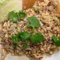 Larb Gai Salad  · Ground chicken mixed with roasted rice, lime juice, Thai chili, green onions, red onions, mi...