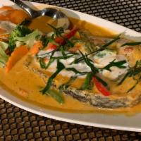 Panang Curry Seafood Special · Panang curry paste with rice coconut milk, carrots, bell peppers and basil leaves.