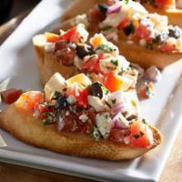 Bruschetta · Toasted Italian bread topped with fresh tomatoes, basil, olive oil and herbs.