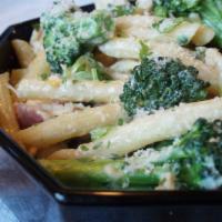 Penne Broccoli E Pollo · Penne pasta sauteed with broccoli and chicken in cream sauce.