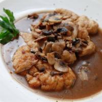 Pollo Marsala · Chicken breast sautéed with mushrooms in a marsala wine sauce, served with potatoes and vege...