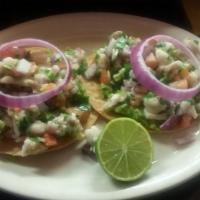 Ceviche Tostadas · Two corn tostadas topped with homemade guacamole and our fresh ceviche.