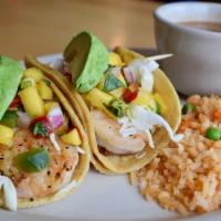 Shrimp Taco Platter · Marinated grilled and seasoned shrimp tacos topped with crunchy cabbage, mango salsa and sli...