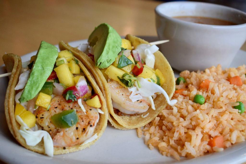 Shrimp Taco Platter · Marinated grilled and seasoned shrimp tacos topped with crunchy cabbage, mango salsa and sliced avocados.