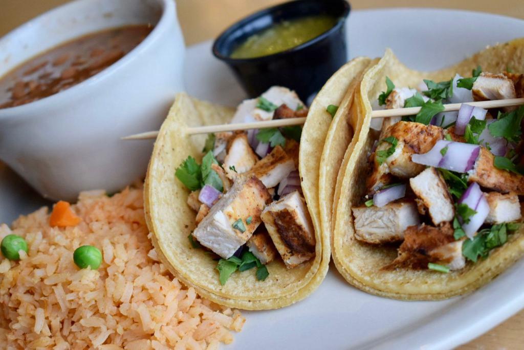 Fajita Taco Platter · Grilled steak or chicken fajita served street style with diced onions, cilantro, and a side of salsa verde.