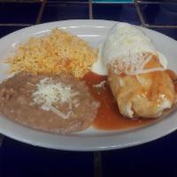Baja Burrito · Bursting at the seams with Mexican rice, refried beans, cheese, lettuce, tomatoes, sour crea...