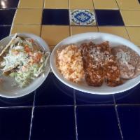 La Paz · 2 crispy seasoned ground beef tacos and 2 hand-rolled cheese enchiladas topped with chili co...