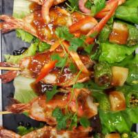 Kung MaKam · Jumbo prawn with shell, pineapple, and tamarind sauce.