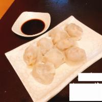 B09. Pork, Shrimp and Chives Dumpling 三鮮水餃 · Filled dough. 