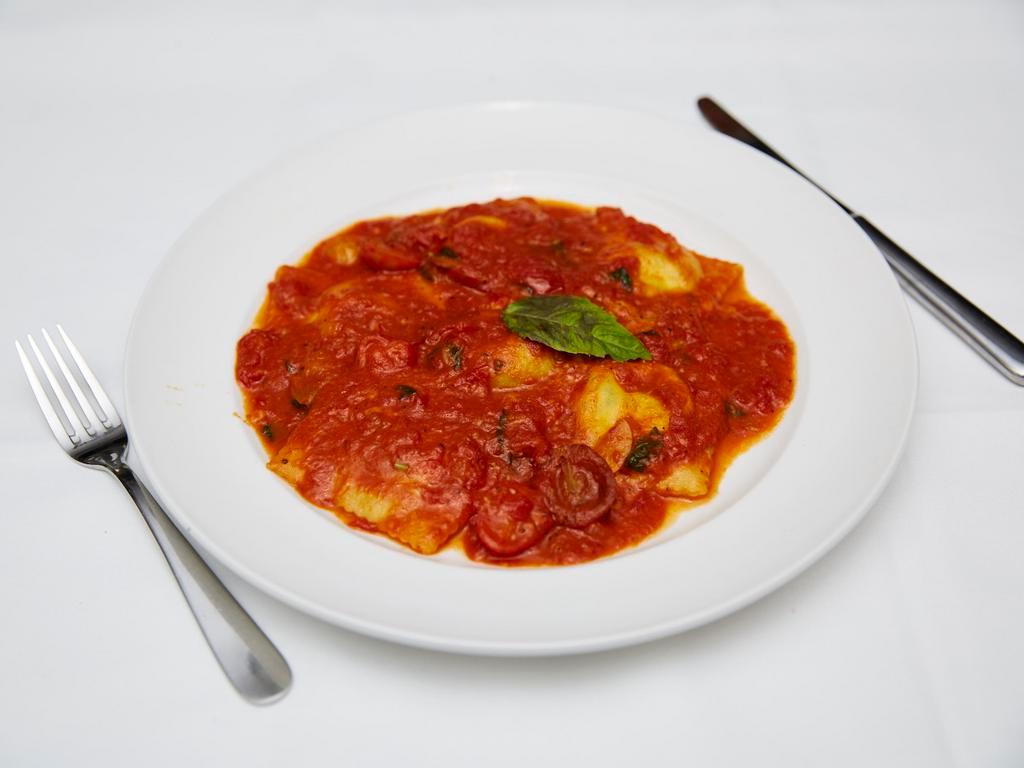 I’Nostri Ravioli di Ricotta e Spinaci · Homemade ravioli with spinach, ricotta and tomato sauce.
