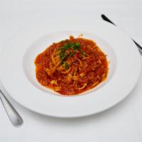 Fettucine alla Ragu Bolognese · Homemade pasta with Bolognese sauce.
