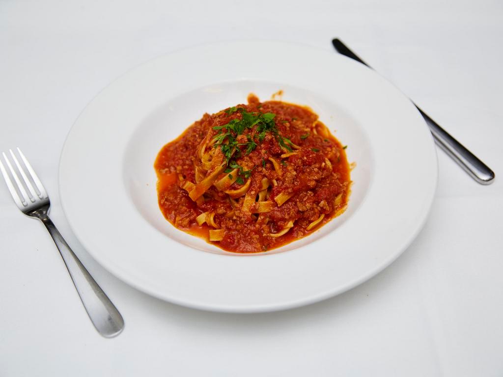 Fettucine alla Ragu Bolognese · Homemade pasta with Bolognese sauce.
