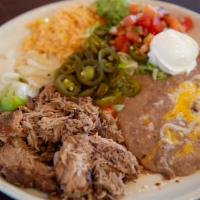 Carnitas Michocan · Pork shoulder slowly braised in Mexican coke and spices. Served with guacamole, sour cream, ...