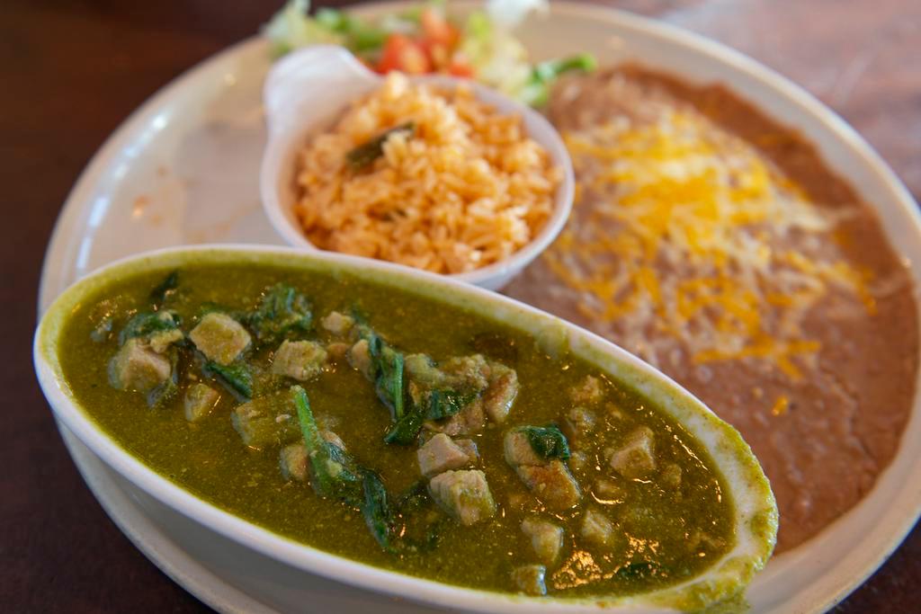 Puerco En Salsa Verde · Pork sirloin, lightly fried and simmered in a tomatillo-pasilla broth until tender. Gluten Free.