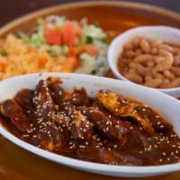 Mole Poblano · Chicken breast slices sauteed in butter and finished with our home-made mole from puebla. Sp...