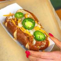 Chili Willie · Cheddar Bratwurst, Beef Chili, Cheddar Cheese, Diced Onion, with or without jalapeno.