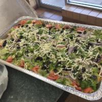 Garden Della Casa Salad · Fresh greens, red onions, green peppers, black olives and tomatoes topped with mozzarella an...