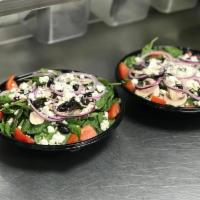 Spinach Salad · Baby spinach with crisp bacon, red onions, tomatoes, black olives, fresh mushrooms and feta ...