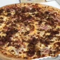 Meat Magnifico Pizza · Pepperoni, ham, capicola, bacon, Italian sausage and mozzarella cheese piled high atop our s...