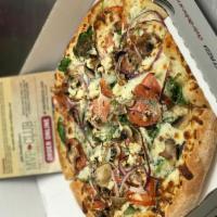 Garlic Spinaci Pizza · A white garlic sauce base topped with baby spinach, red onions, mushrooms and tomatoes, then...