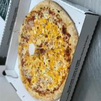 Quattro Cheese Pizza · Mozzarella, feta, pecorino Romano and cheddar cheese melted on our traditional red pizza sau...