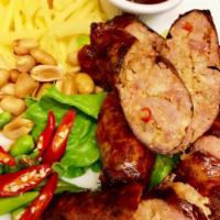 9. Sai Ou · Laos northeastern style chorizo, deep-fried to golden brown, served with chili sauce ,served...