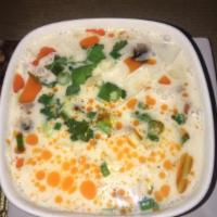 19. Tom Kha Soup · Coconut soup with lemon grass, flavored with galangal, chili, mushrooms and coconut milk.
