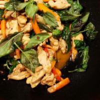 36. Hot Basil · Stir-fried in a hot and spicy garlic sauce, mixed with chili, bell peppers and onions, toppe...