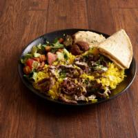 Beef and Lamb Shawarma Plate · Comes with basmati rice, falafel, hummus, fattoush salad, dolmas and fresh pita.